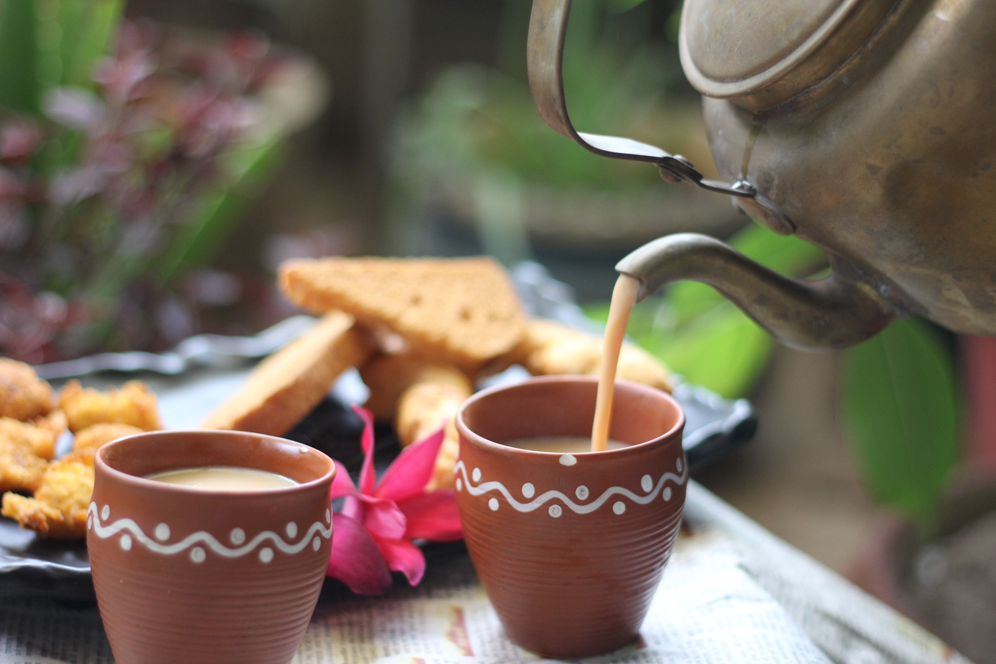 Traditional chai poured into kulhad cups